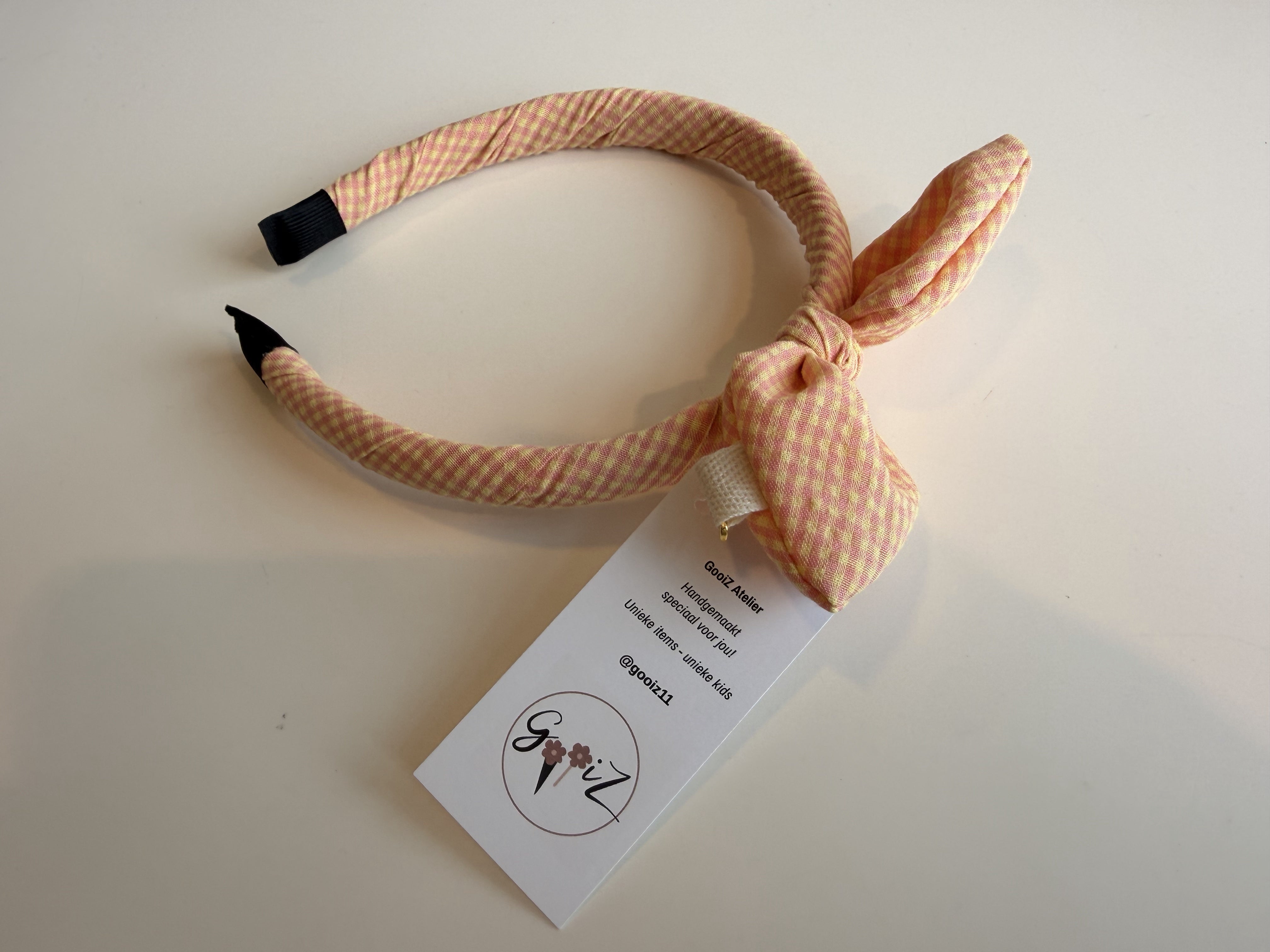 Gooiz | Haarband strik - ruit zalm/roze