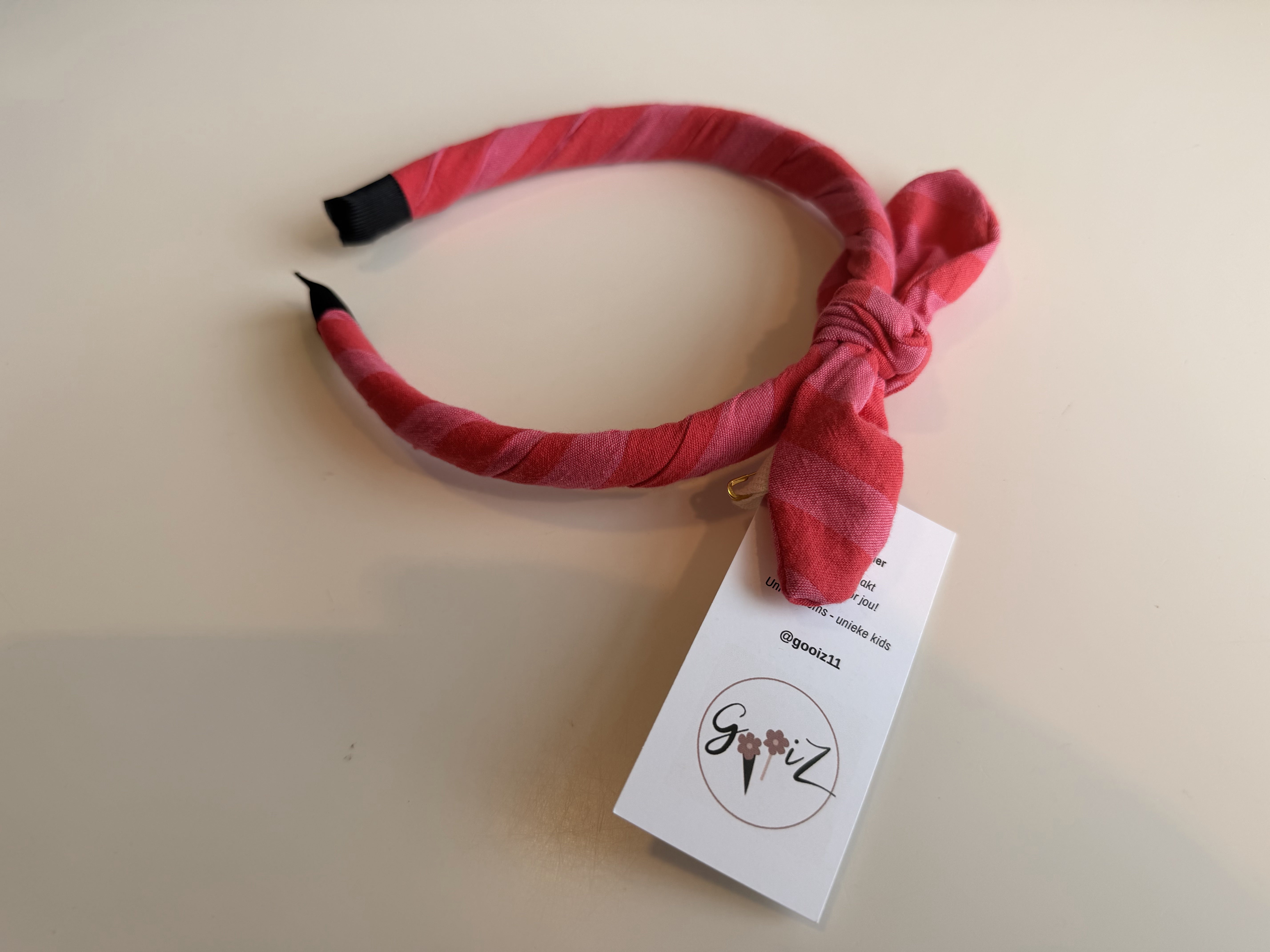 Gooiz | Haarband strik - streep roze/fuchsia